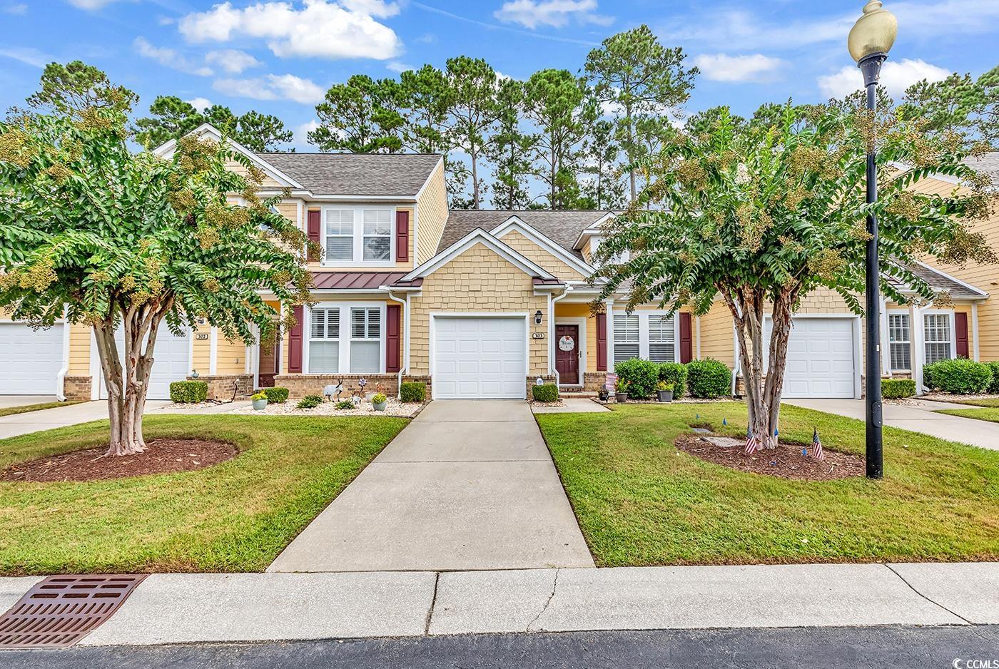 112 Coldstream Cove Loop, Unit 303 Murrells Inlet, SC 29576 - Photo 37 of 39 View of front of property featuring a front yard a