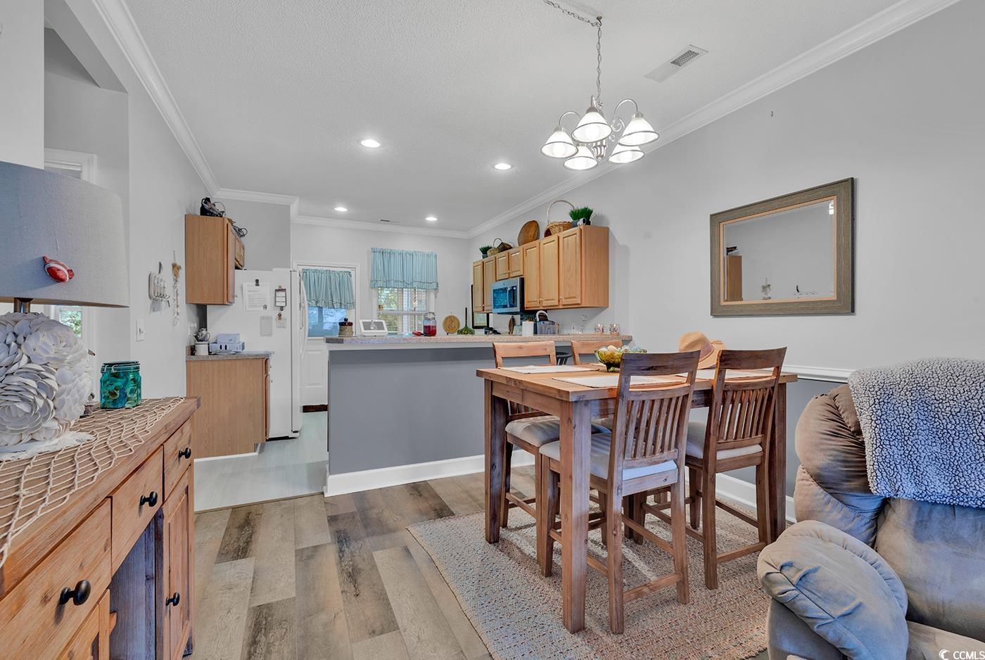 112 Coldstream Cove Loop, Unit 303 Murrells Inlet, SC 29576 - Photo 6 of 39 Dining area featuring light hardwood / wood-style