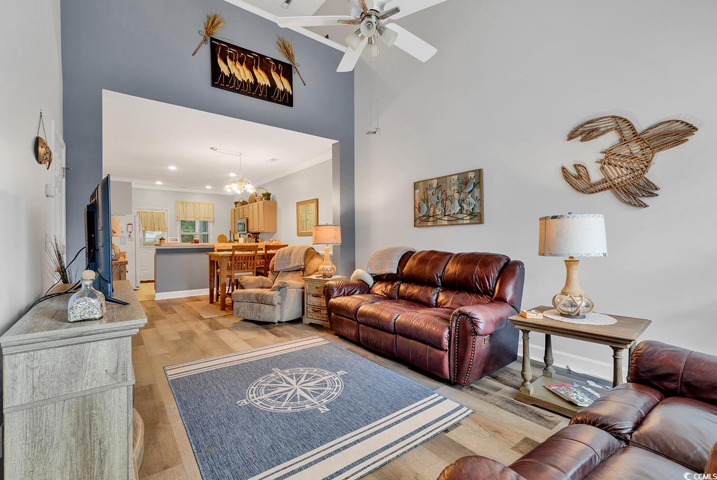 112 Coldstream Cove Loop, Unit 303 Murrells Inlet, SC 29576 - Photo 9 of 39 Living room featuring ceiling fan with notable cha