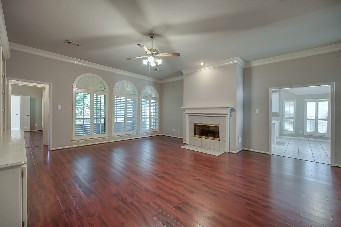 3510 Ash Glen Drive Spring, TX 77388 - Photo 13 of 39 a view of an empty room with wooden floor and a fireplace