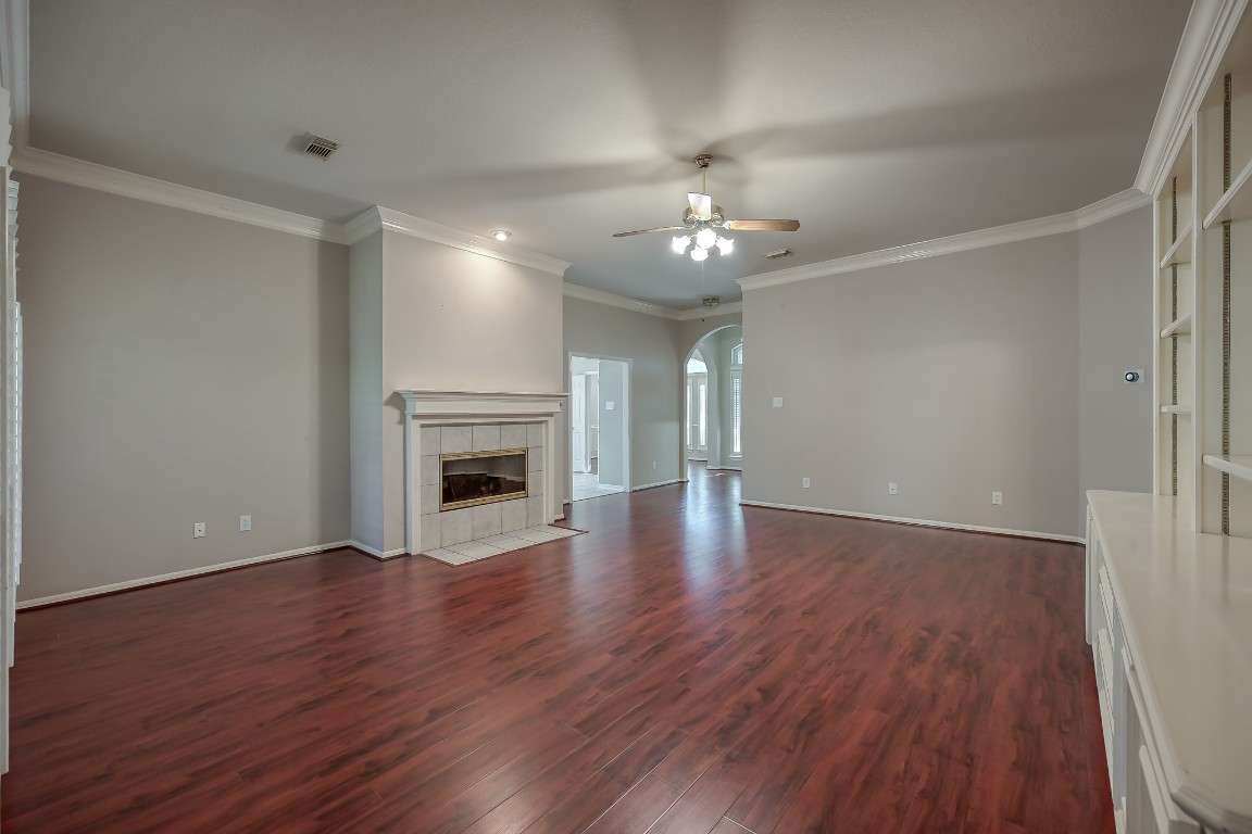 3510 Ash Glen Drive Spring, TX 77388 - Photo 14 of 39 a view of an empty room with wooden floor and fireplace