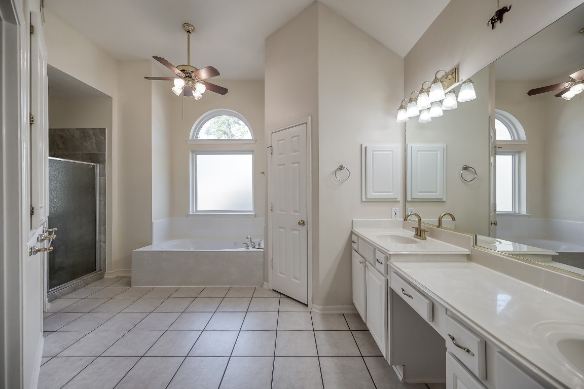 3510 Ash Glen Drive Spring, TX 77388 - Photo 25 of 39 a spacious bathroom with a granite countertop sink a toilet a mirror and shower