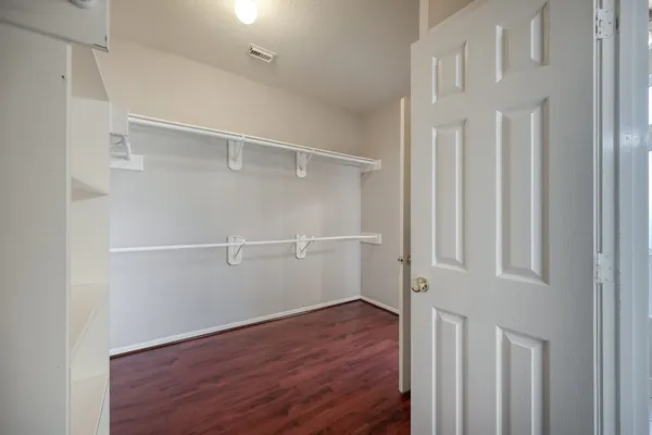 a view of an empty walk in closet