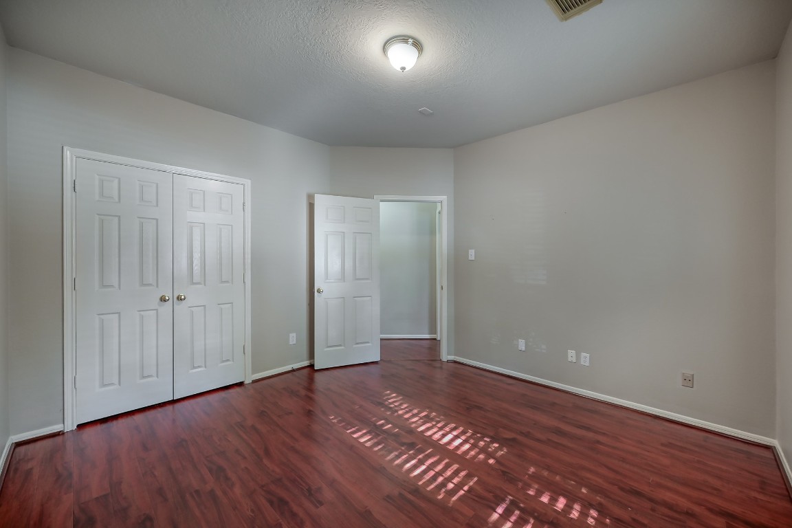 3510 Ash Glen Drive Spring, TX 77388 - Photo 28 of 39 a view of an empty room with wooden floor and a window