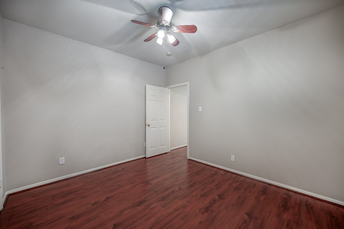 3510 Ash Glen Drive Spring, TX 77388 - Photo 31 of 39 a view of a room with wooden floor and a ceiling fan