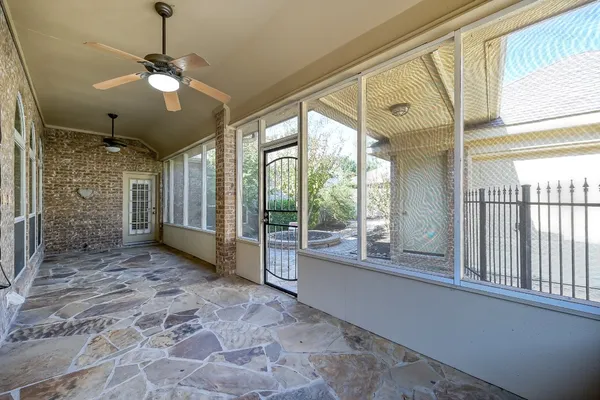 a view of a livingroom with a ceiling fan and window