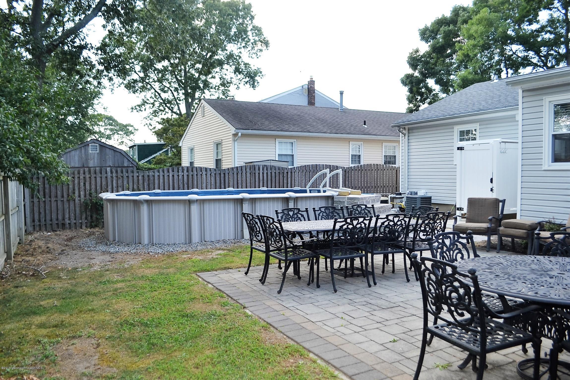 2214 Wilson Road Point Pleasant, NJ 08742 - Photo 15 of 16 a view of a dinning table and chairs in patio
