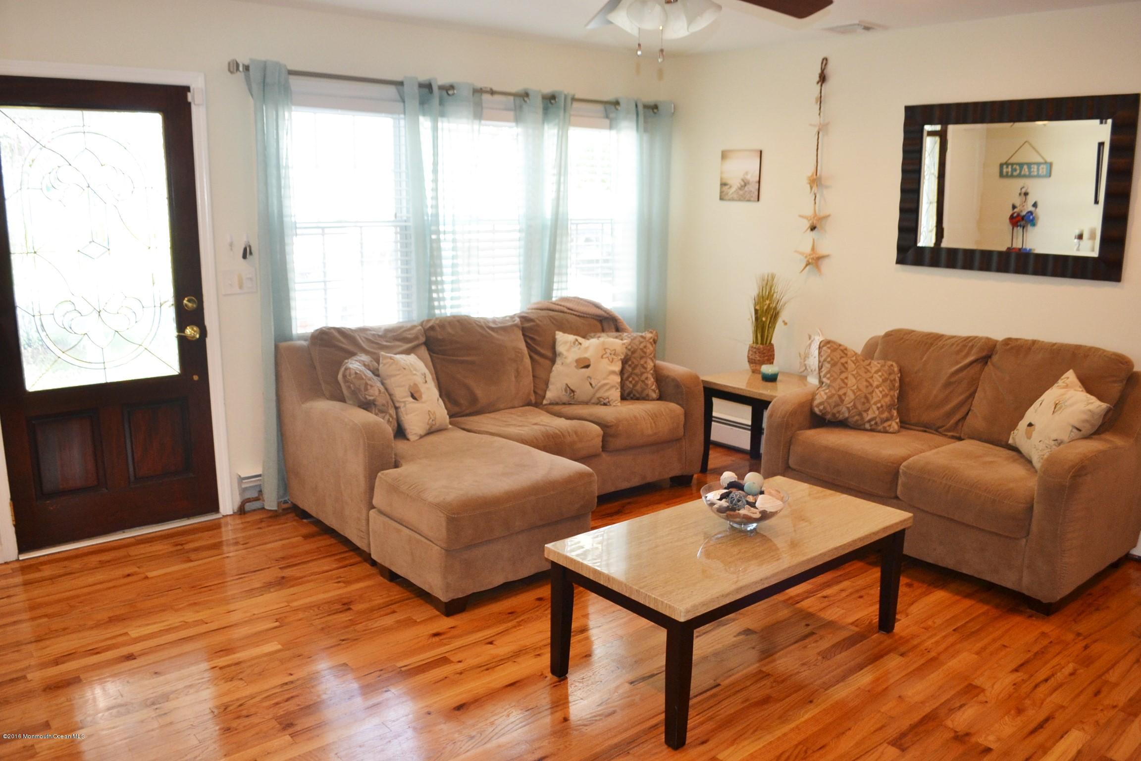 2214 Wilson Road Point Pleasant, NJ 08742 - Photo 3 of 16 a living room with furniture and a window