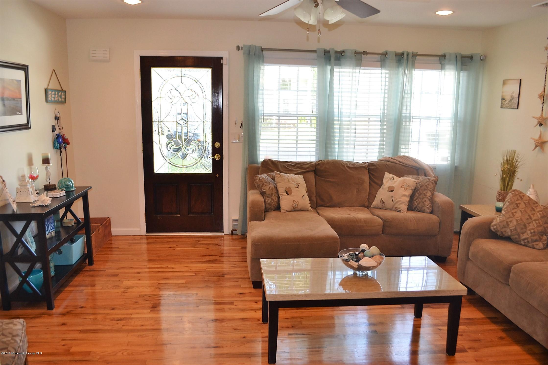 2214 Wilson Road Point Pleasant, NJ 08742 - Photo 4 of 16 a living room with furniture and a window