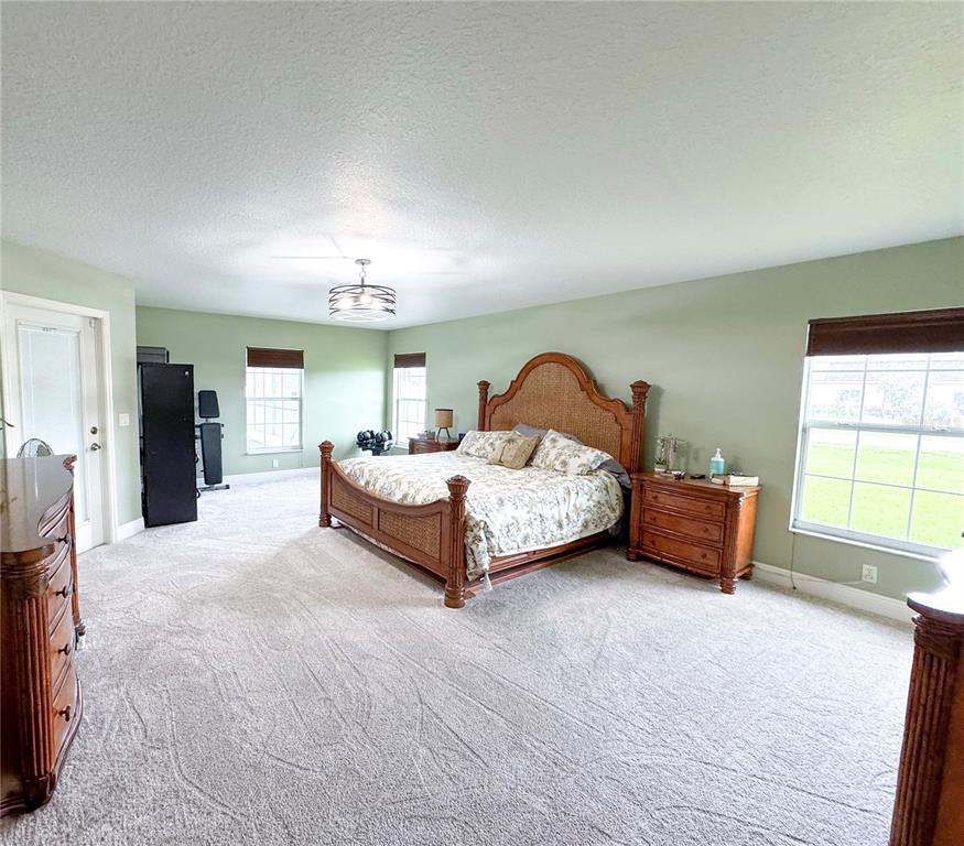 6282 Northeast 61st Ave Road Silver Springs, FL 34488 - Photo 14 of 73 a bedroom with bed and a window