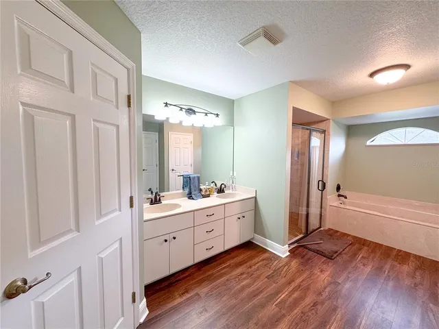 a kitchen with stainless steel appliances granite countertop a kitchen island a stove and a sink