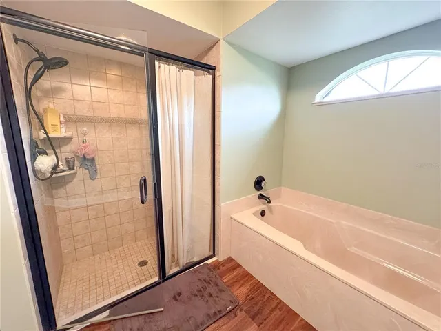 a living room with furniture window and wooden floor