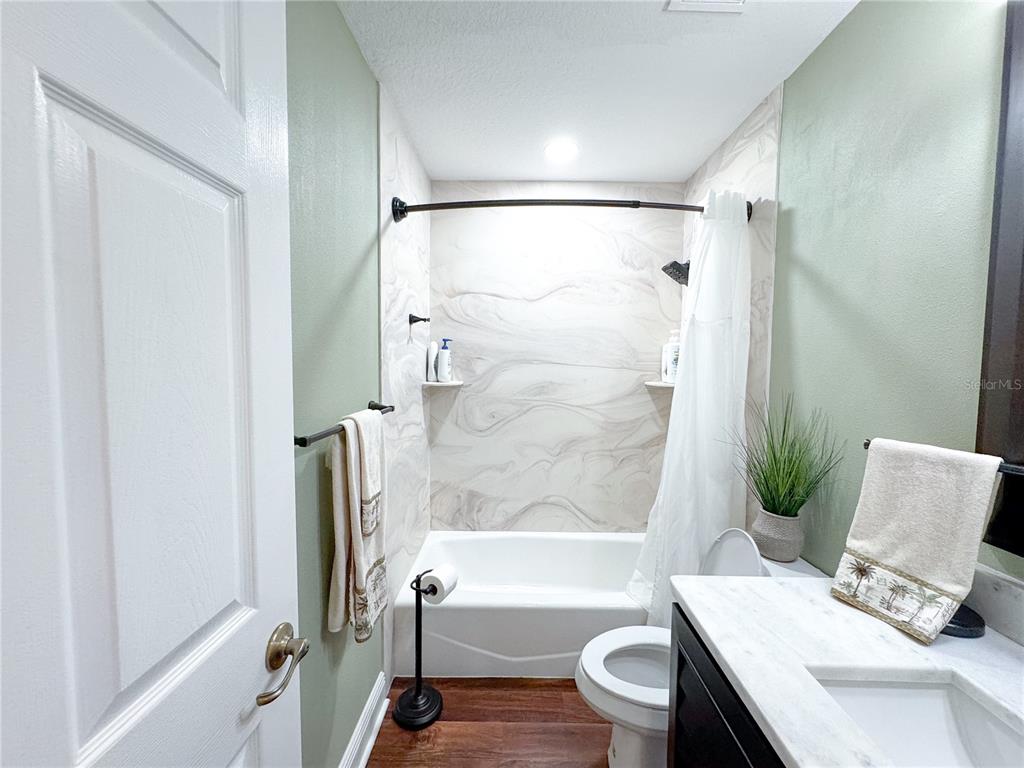 6282 Northeast 61st Ave Road Silver Springs, FL 34488 - Photo 37 of 73 a bathroom with a sink and a mirror