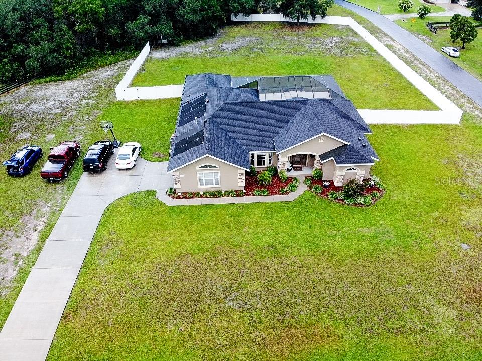6282 Northeast 61st Ave Road Silver Springs, FL 34488 - Photo 4 of 73 a aerial view of a house with swimming pool and big yard