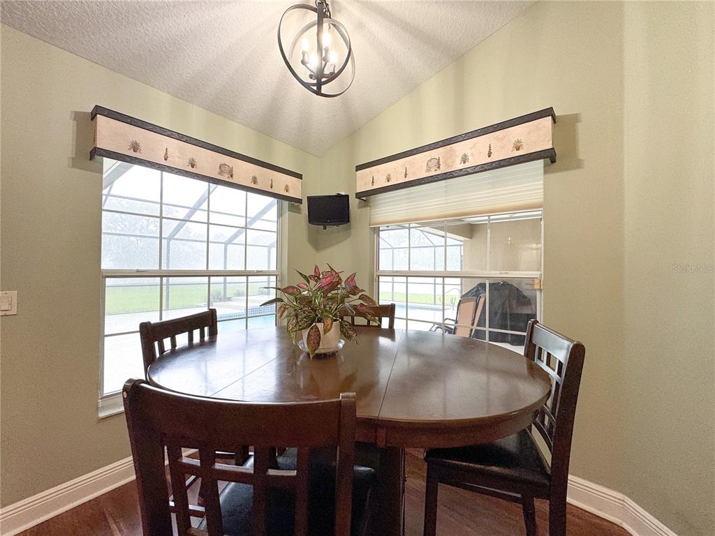 6282 Northeast 61st Ave Road Silver Springs, FL 34488 - Photo 43 of 73 a view of a dining room with furniture window and outside view