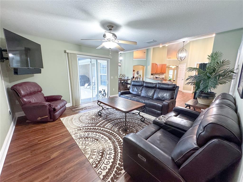 6282 Northeast 61st Ave Road Silver Springs, FL 34488 - Photo 49 of 73 a living room with furniture fireplace and a large window