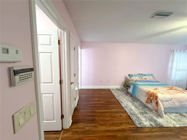 a view of a garage with an bike and car