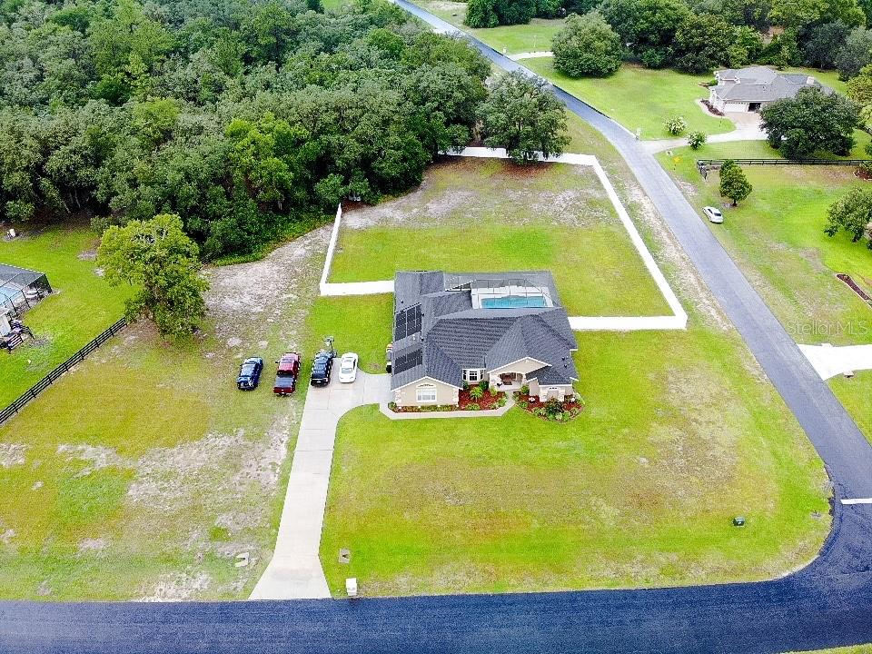 6282 Northeast 61st Ave Road Silver Springs, FL 34488 - Photo 5 of 73 a view of a swimming pool with a yard