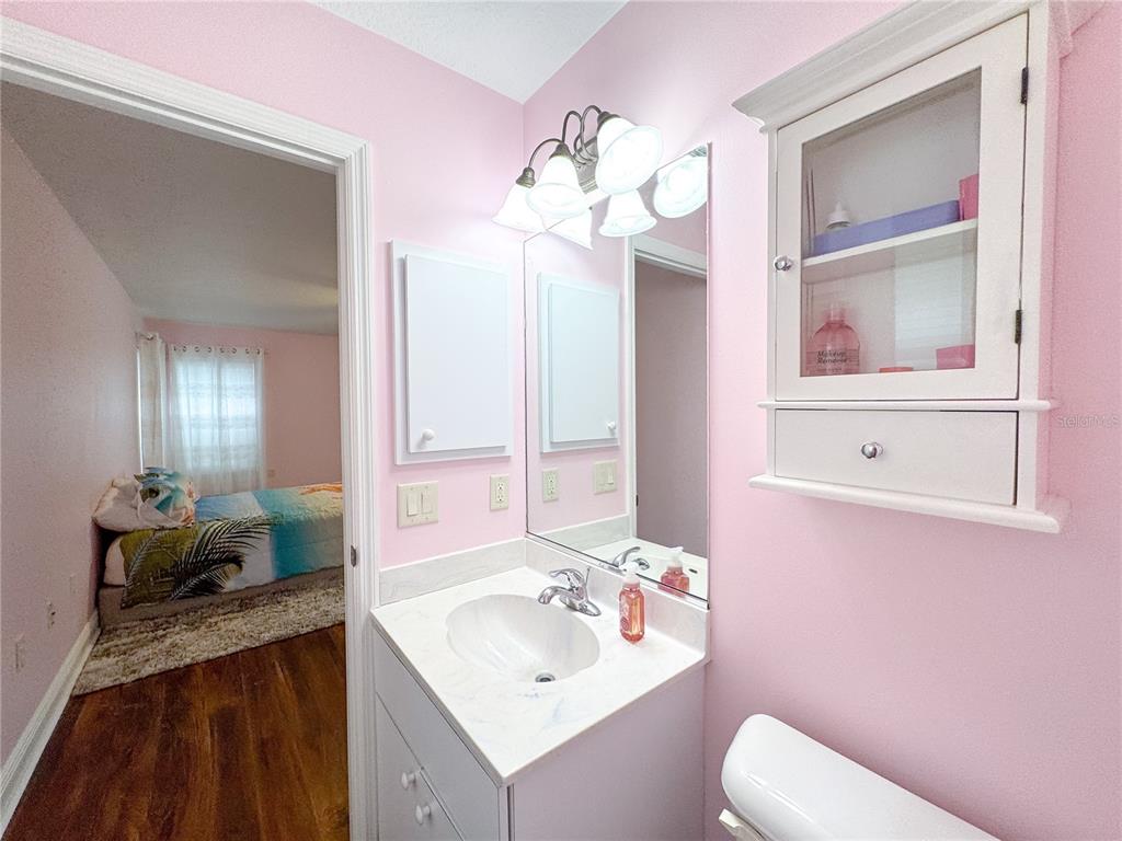 6282 Northeast 61st Ave Road Silver Springs, FL 34488 - Photo 59 of 73 a bathroom with a sink vanity tub and toilet