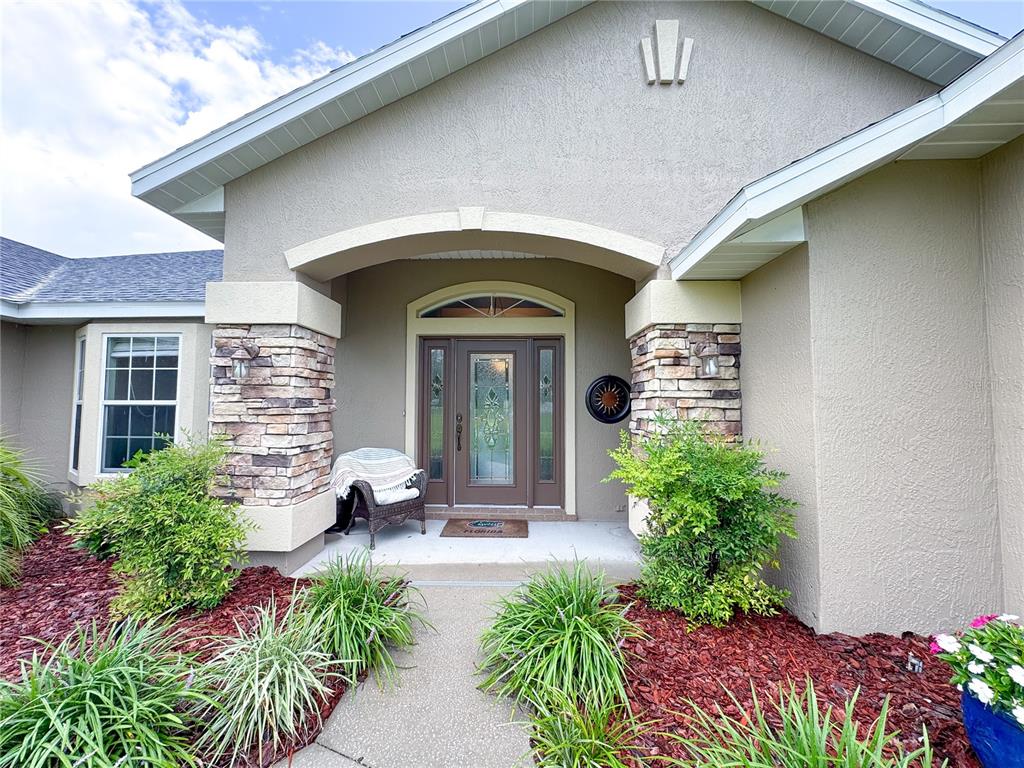 6282 Northeast 61st Ave Road Silver Springs, FL 34488 - Photo 6 of 73 a front view of a house with a yard