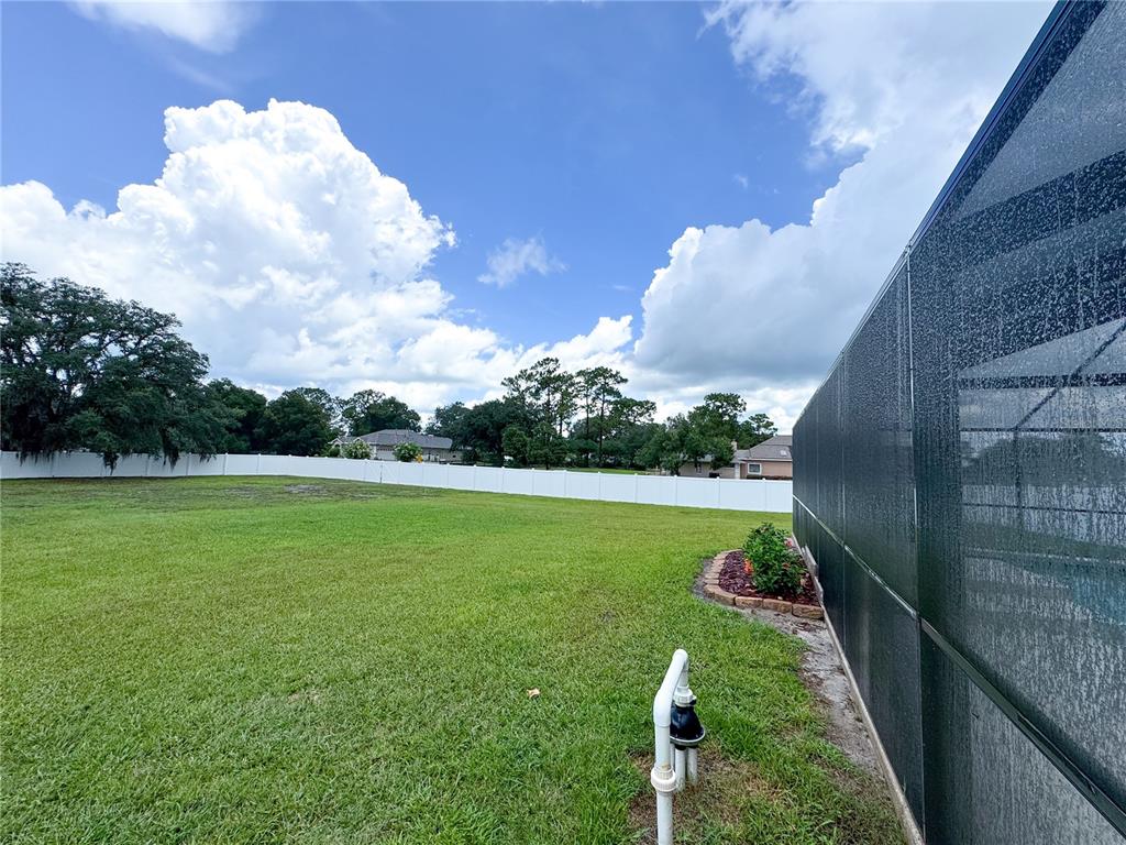 6282 Northeast 61st Ave Road Silver Springs, FL 34488 - Photo 67 of 73 a view of a golf course with a lake