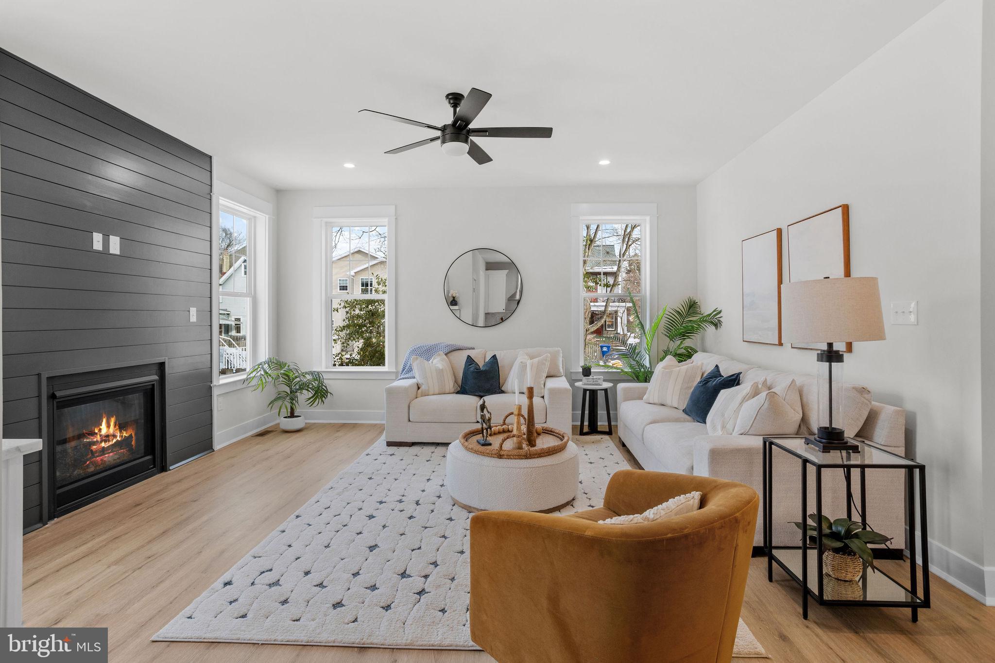 406 Midway Riverton, NJ 08077 - Photo 8 of 30 a living room with furniture a fireplace and a large mirror