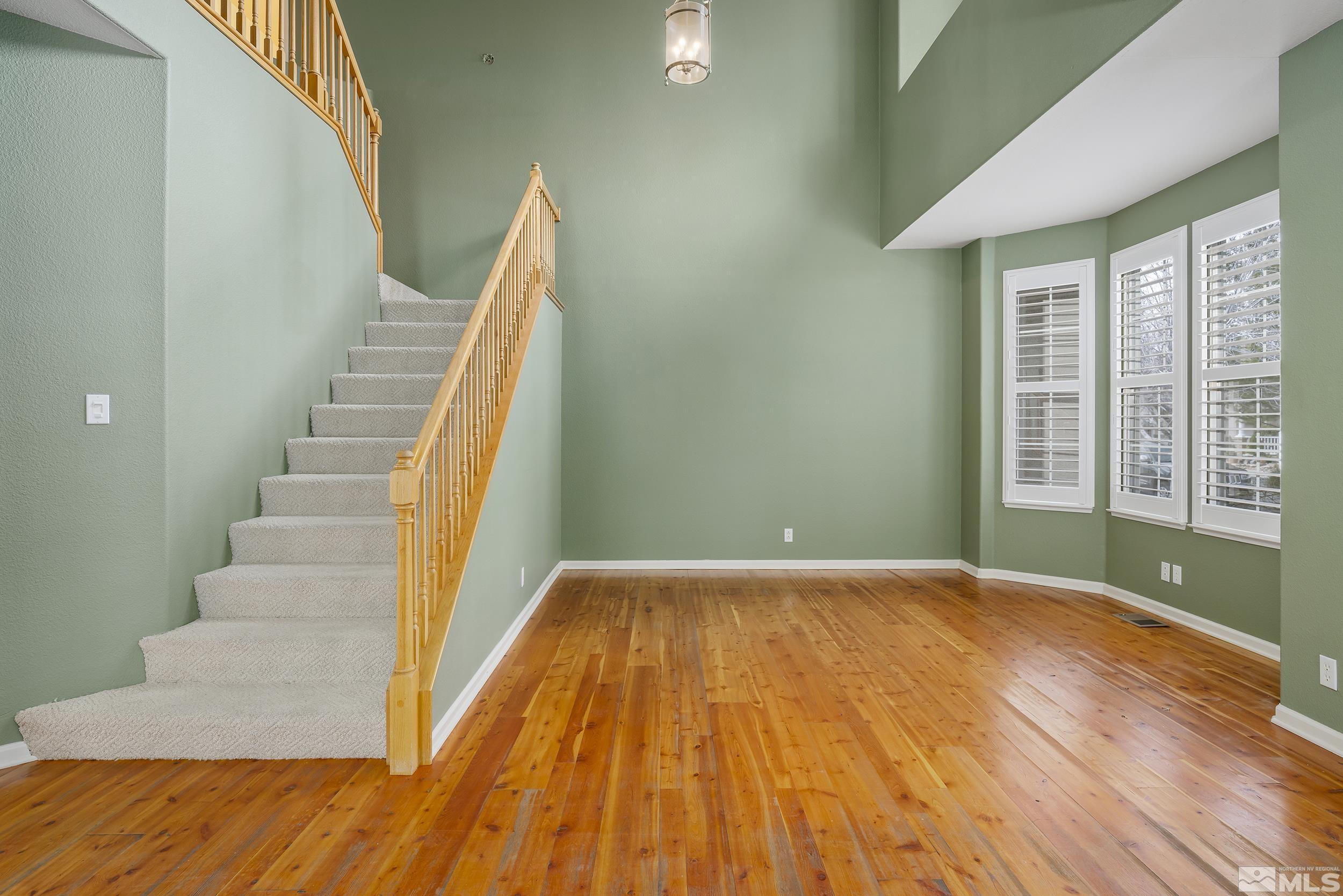 1270 Greenwich Way Reno, NV 89519 - Photo 5 of 20 a view of room with stairs and wooden floor