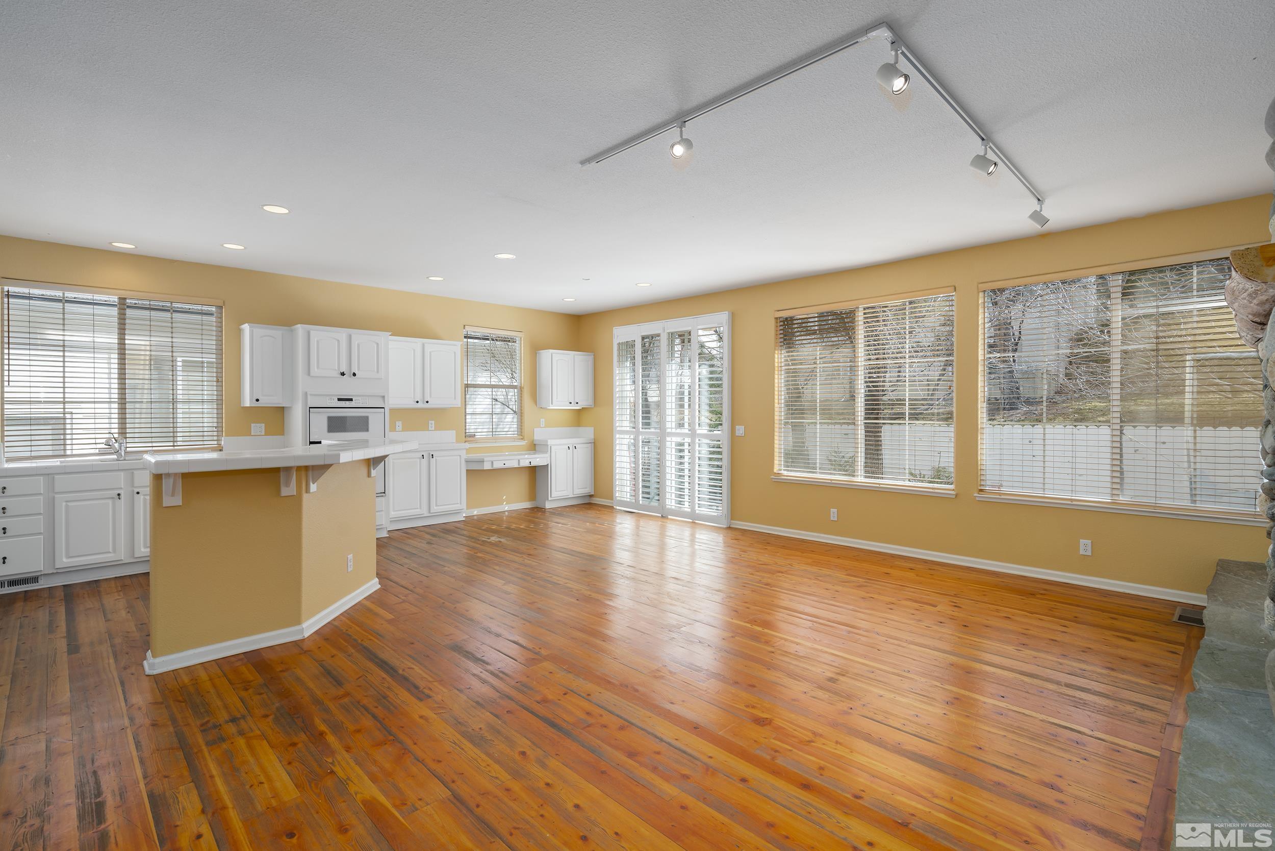 1270 Greenwich Way Reno, NV 89519 - Photo 10 of 20 a view of kitchen with wooden floor and large window