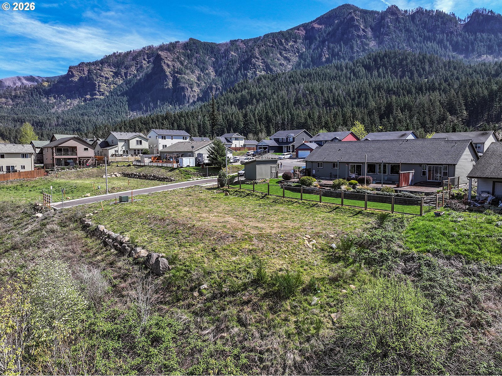 Manchester Drive Cascade Locks, OR 97014 - Photo 5 of 16 a view of a house with garden and sitting area