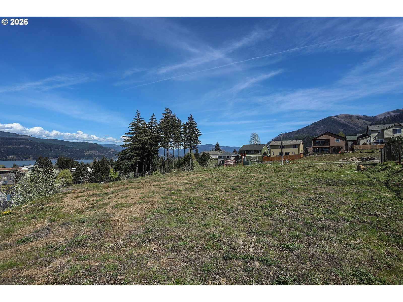 Manchester Drive Cascade Locks, OR 97014 - Photo 8 of 16 a view of a yard with an trees