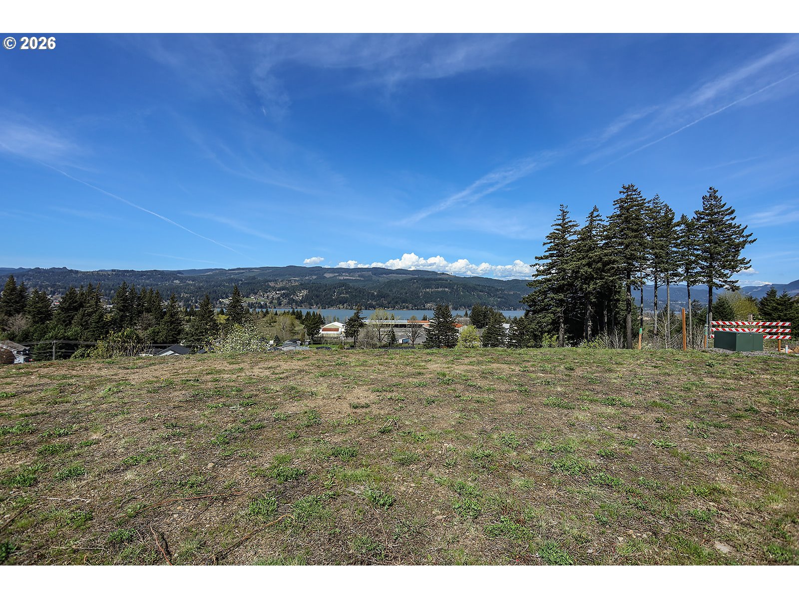 Manchester Drive Cascade Locks, OR 97014 - Photo 10 of 16 a view of a dry yard with trees