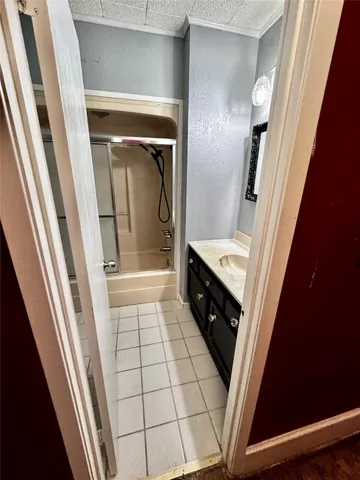 a view of a livingroom with a ceiling fan and window