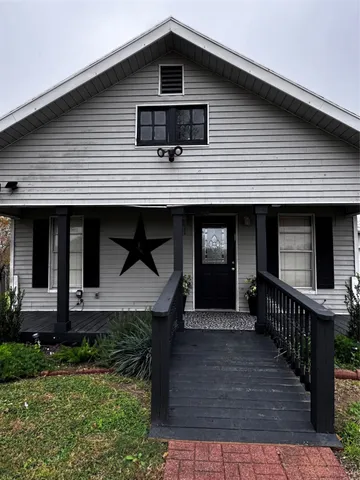 a view of a swimming pool with an outdoor space and seating area