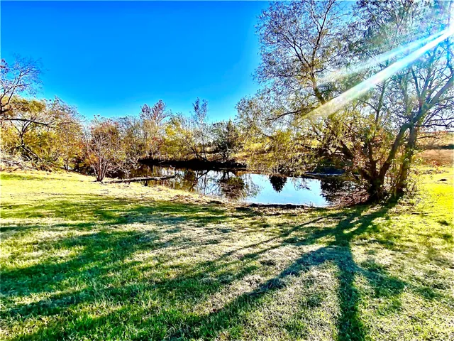a view of a lake with a big yard