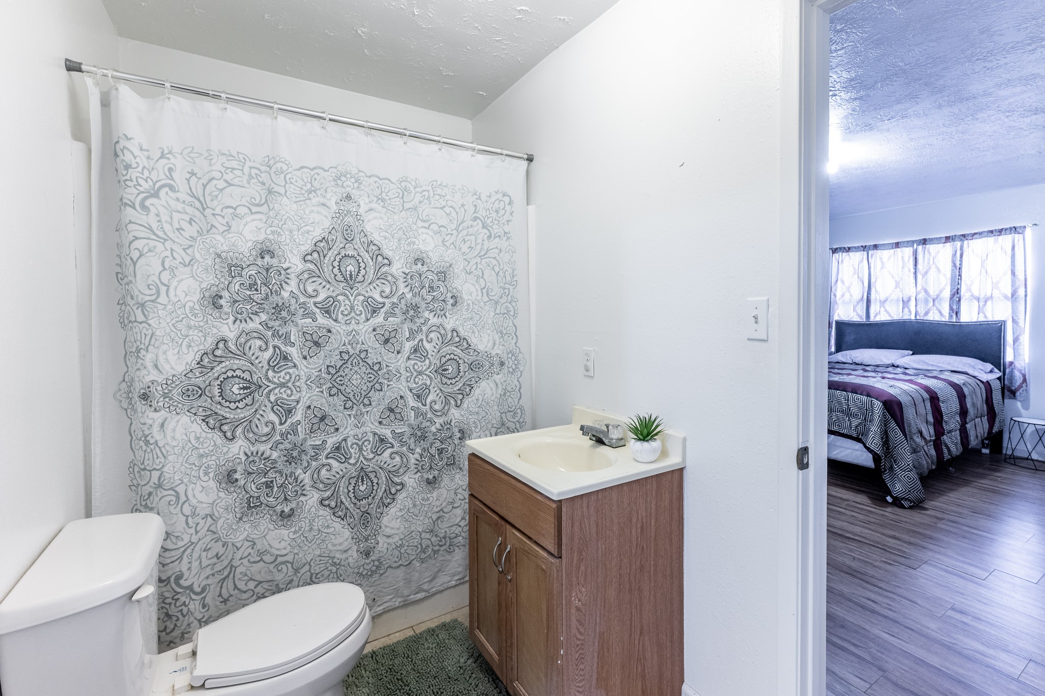 20471 Roy Hall Road Bedias, TX 77831 - Photo 12 of 24 a bathroom with a sink toilet and vanity