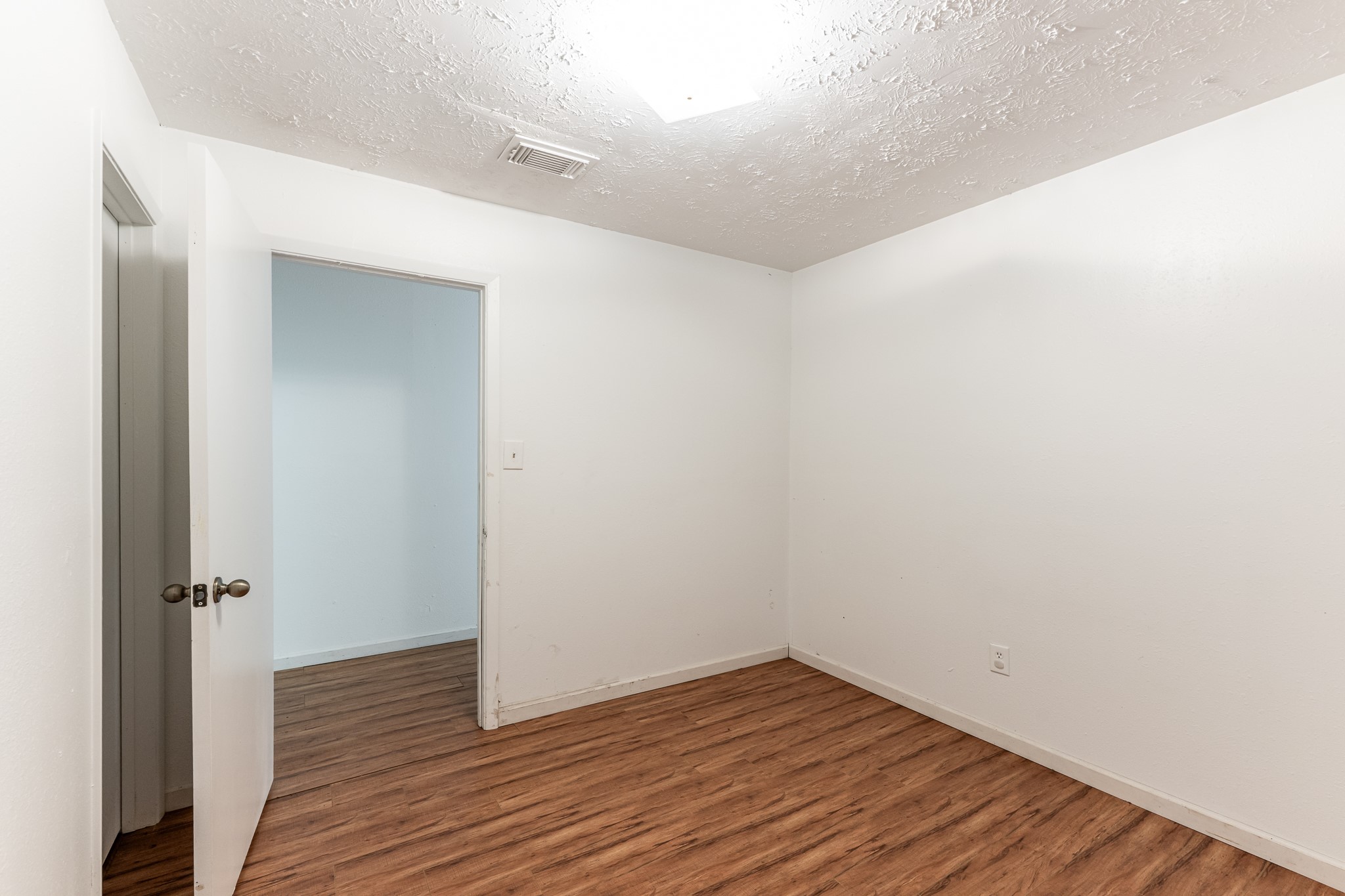 20471 Roy Hall Road Bedias, TX 77831 - Photo 13 of 24 a view of a room with wooden floor