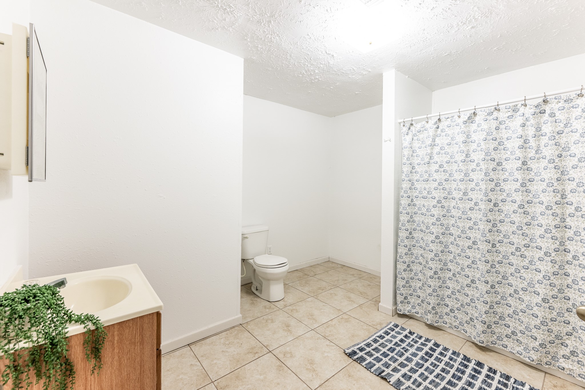 20471 Roy Hall Road Bedias, TX 77831 - Photo 18 of 24 a bathroom with a sink and a toilet