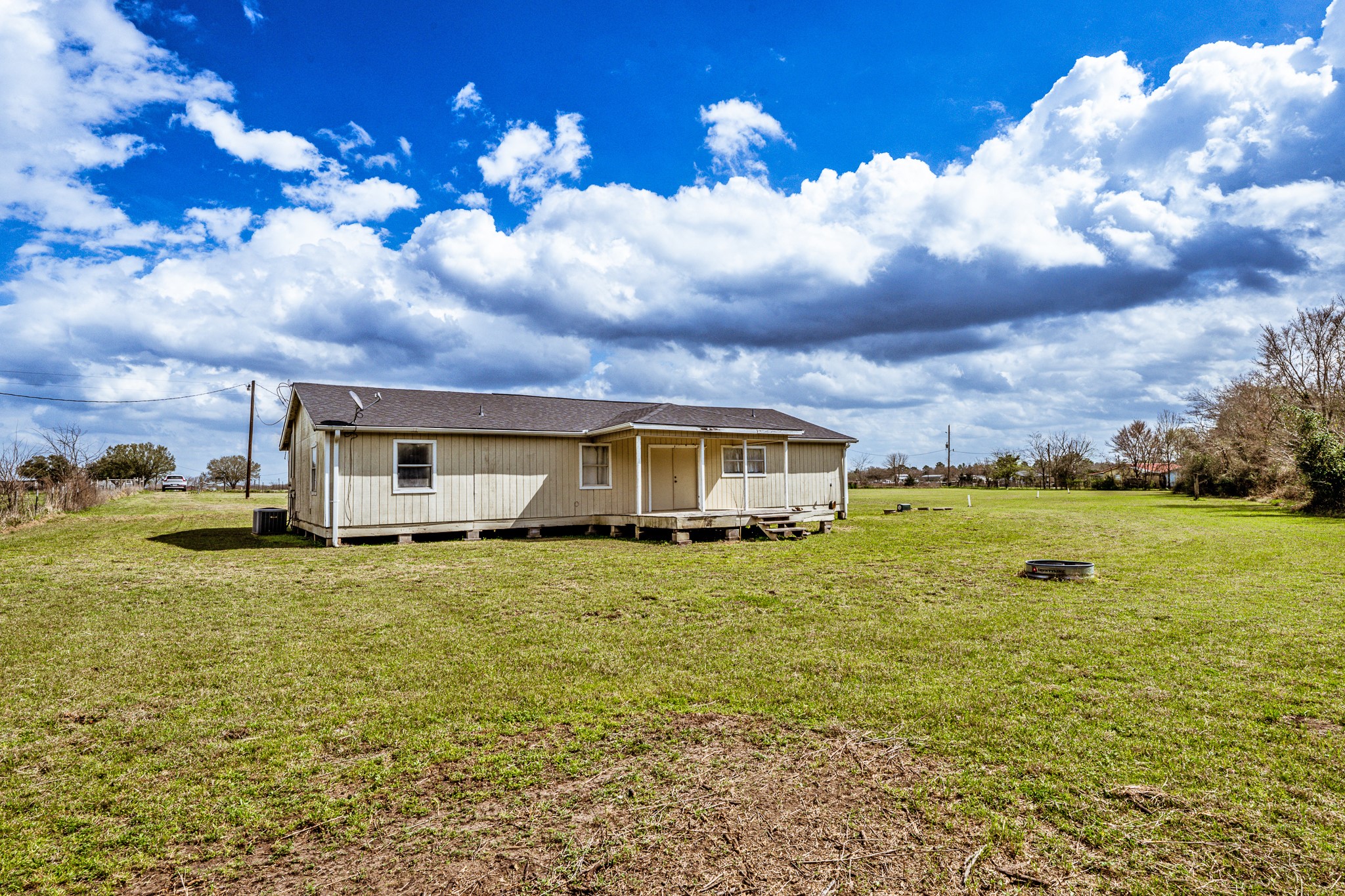 20471 Roy Hall Road Bedias, TX 77831 - Photo 20 of 24 a house view with a garden space