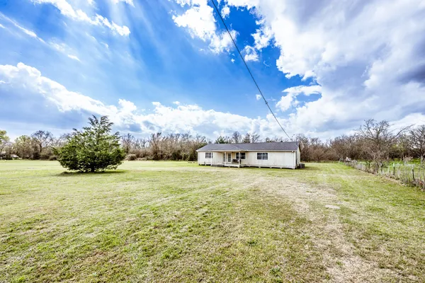 a house with yard in front of it