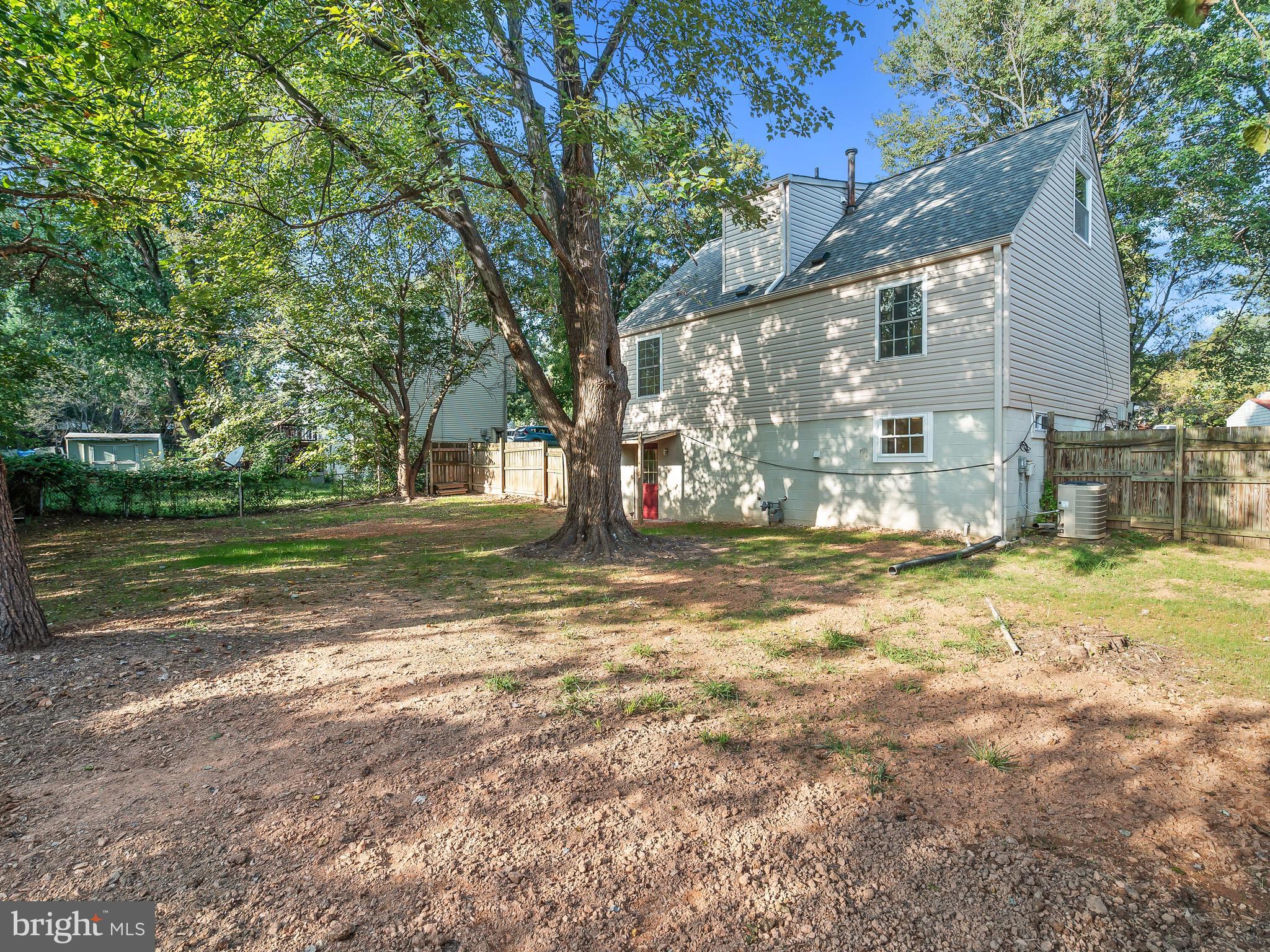 19044 Staleybridge Road Germantown, MD 20876 - Photo 30 of 30 a view of a house with a yard