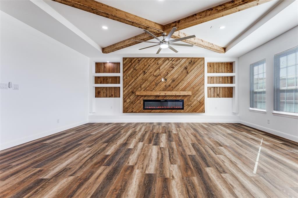 2612 Burchill Road Fort Worth, TX 76105 - Photo 6 of 25 wooden floor in an empty room with a fireplace