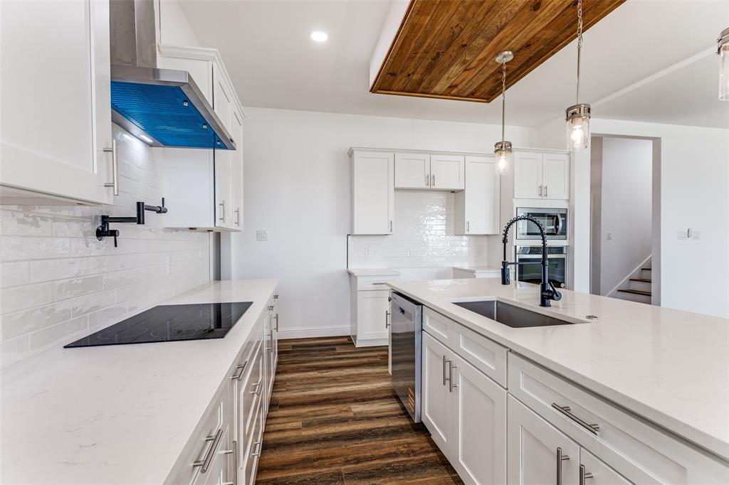2612 Burchill Road Fort Worth, TX 76105 - Photo 8 of 25 a kitchen with a sink and cabinets