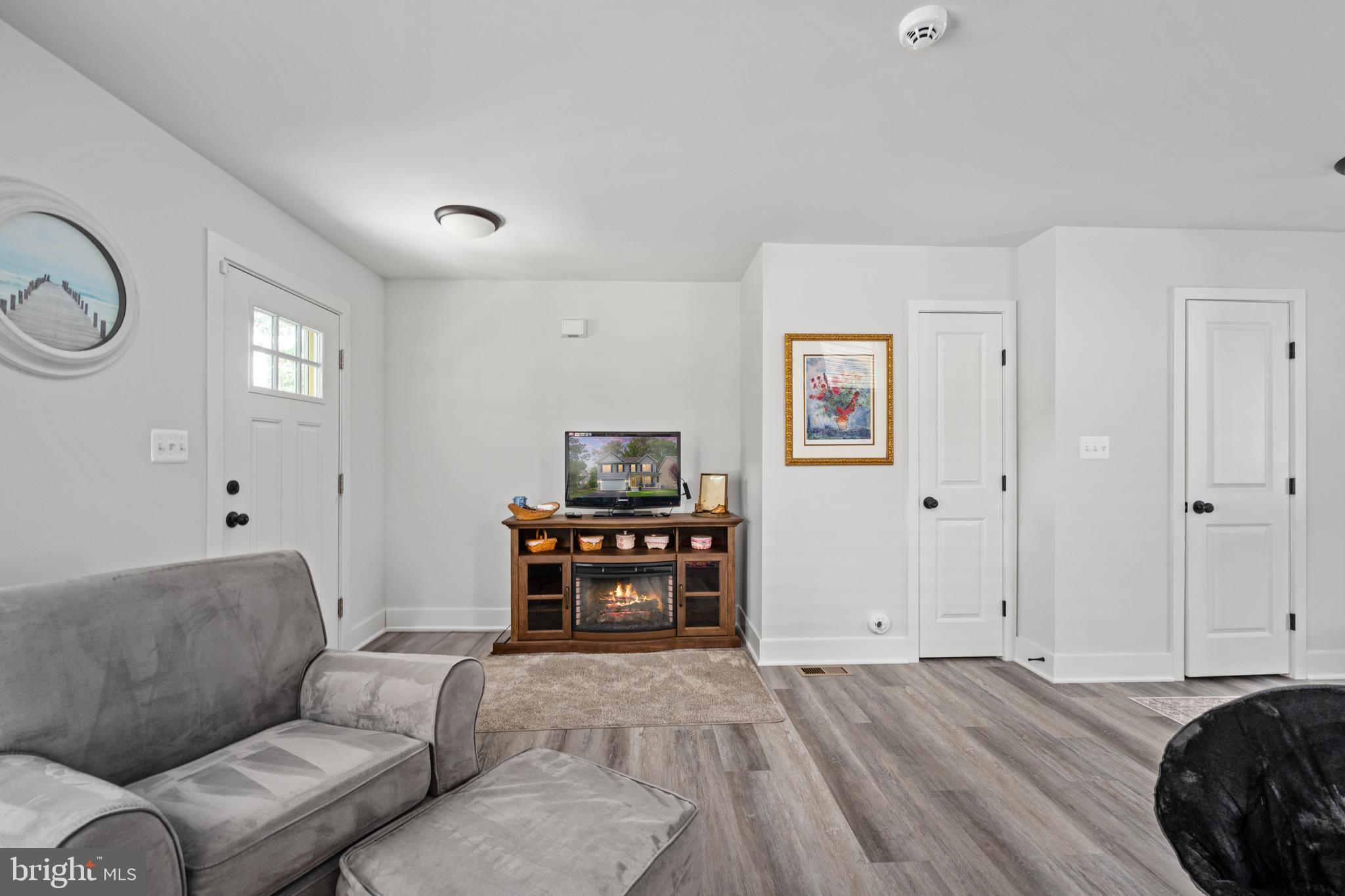 133 7th Street Colonial Beach, VA 22443 - Photo 14 of 72 a bedroom with furniture and a window