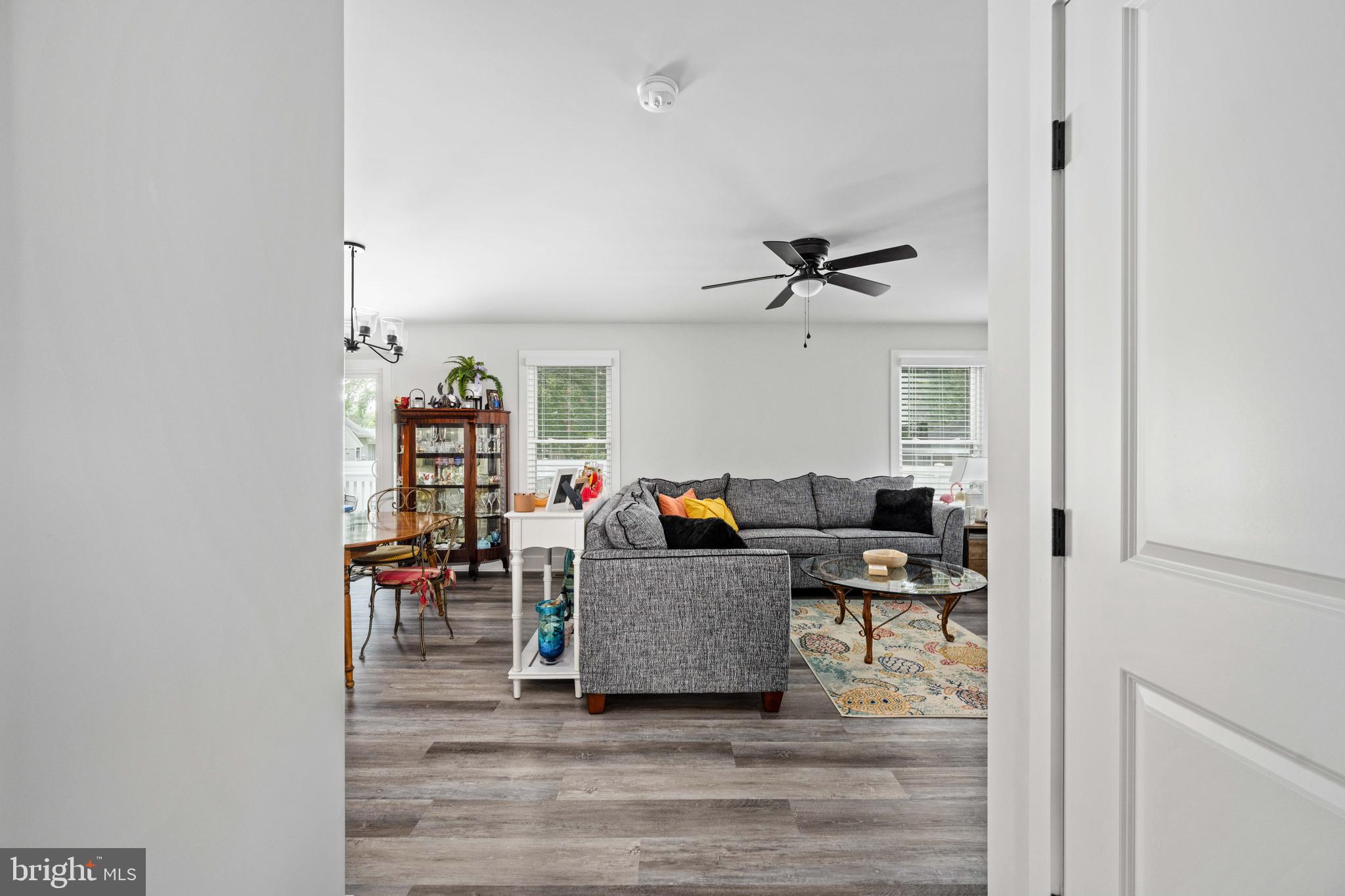 133 7th Street Colonial Beach, VA 22443 - Photo 19 of 72 a living room with furniture and a wooden floor