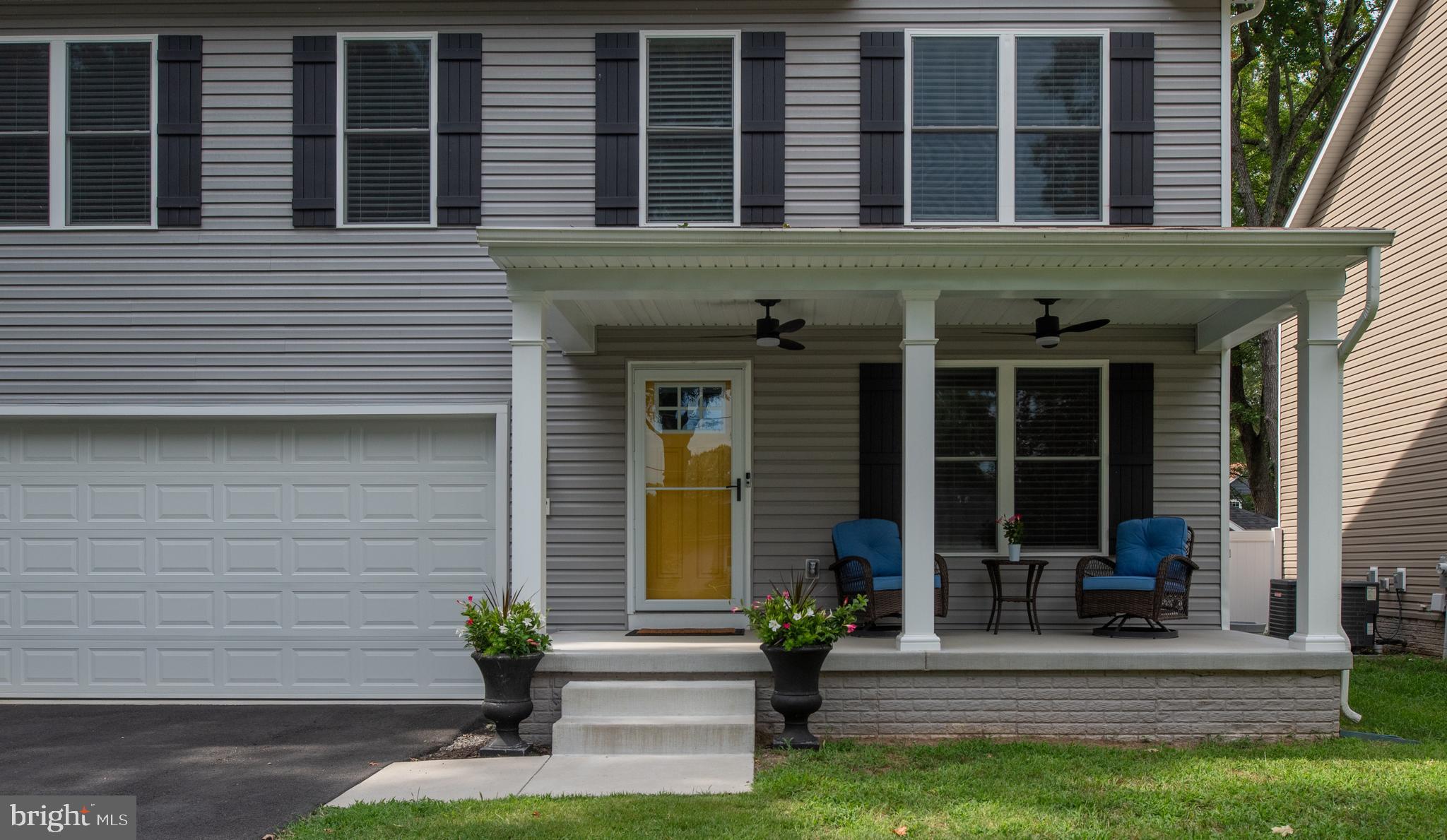 133 7th Street Colonial Beach, VA 22443 - Photo 3 of 72 a front view of a house with a yard