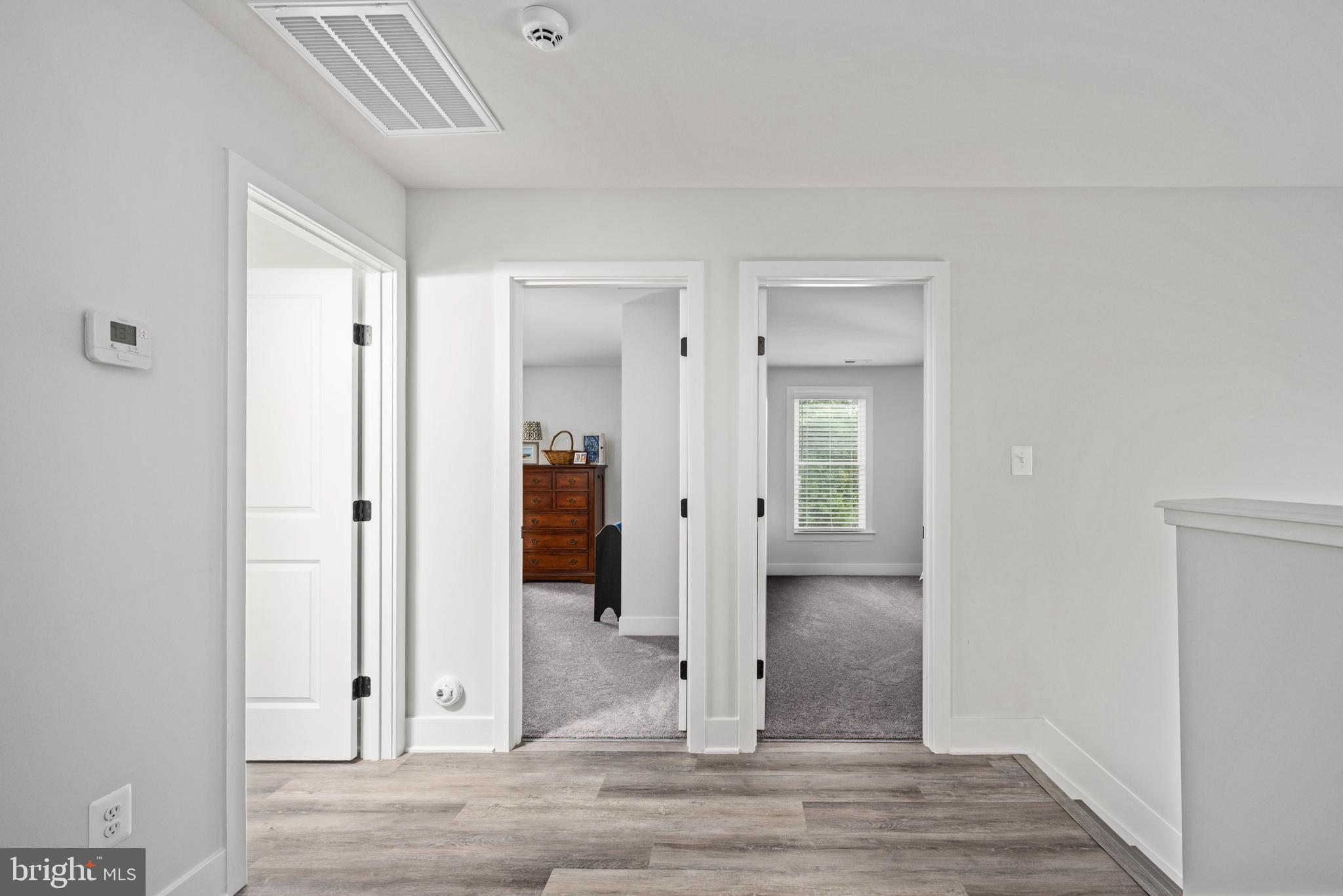 133 7th Street Colonial Beach, VA 22443 - Photo 33 of 72 wooden floor with white walls