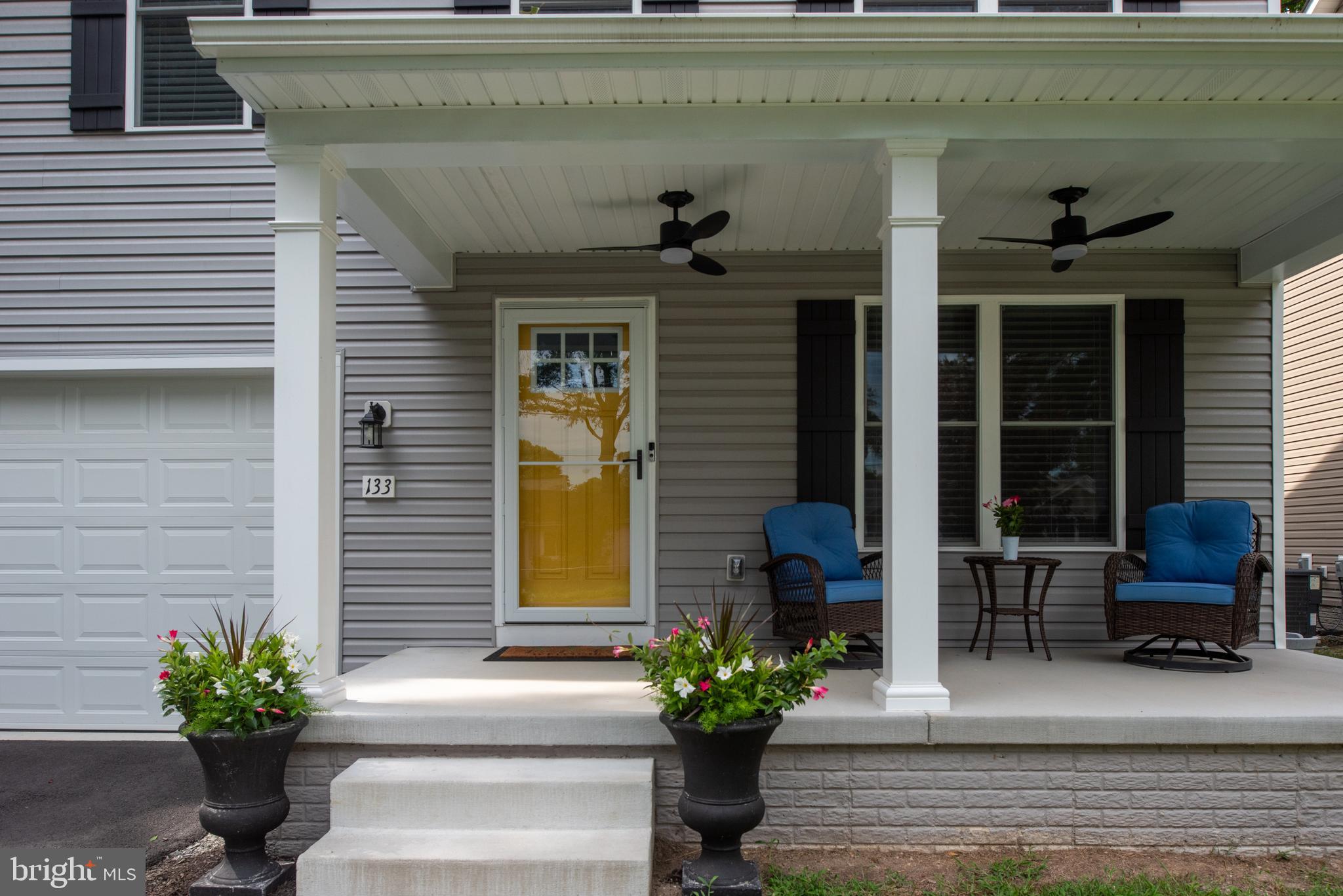 133 7th Street Colonial Beach, VA 22443 - Photo 4 of 72 a view of a house with potted plants
