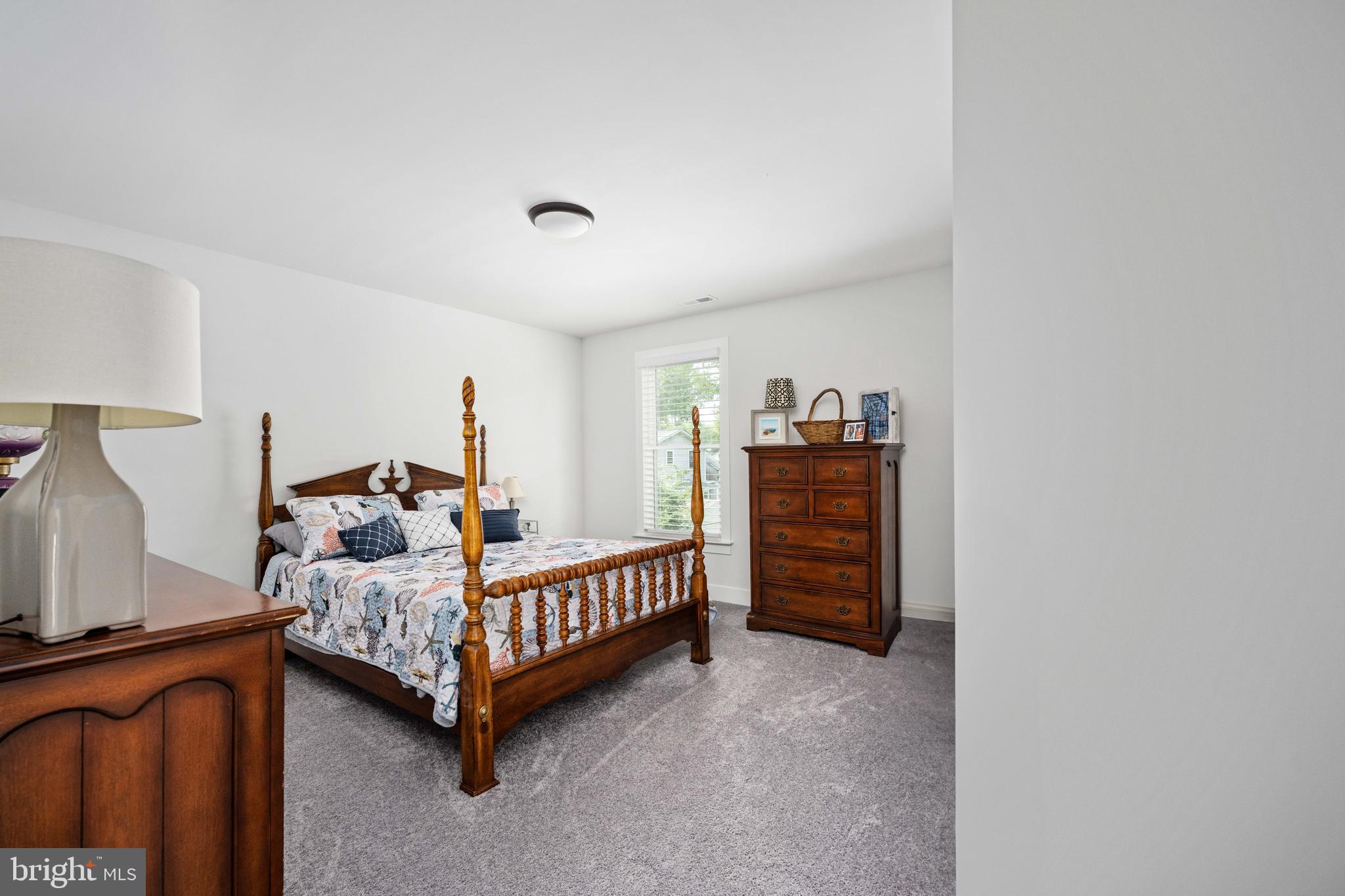 133 7th Street Colonial Beach, VA 22443 - Photo 44 of 72 a bedroom with furniture and a baby crib