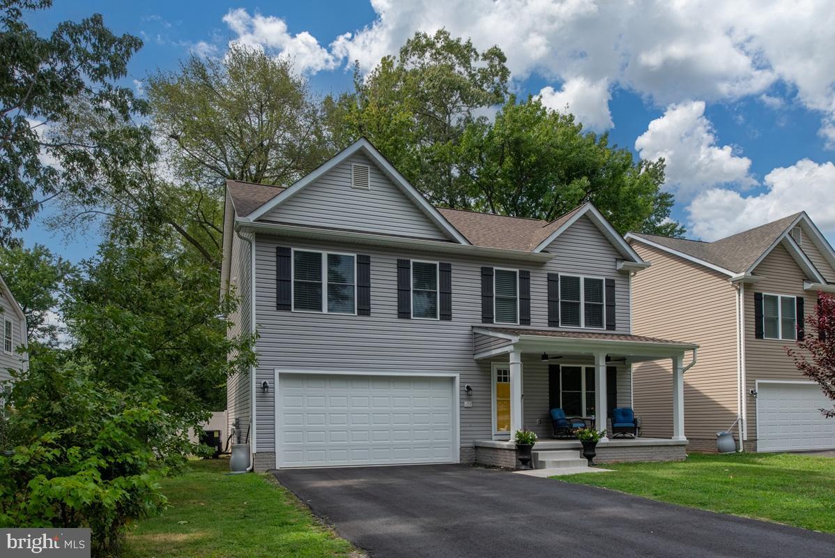 133 7th Street Colonial Beach, VA 22443 - Photo 56 of 72 a front view of a house with a yard