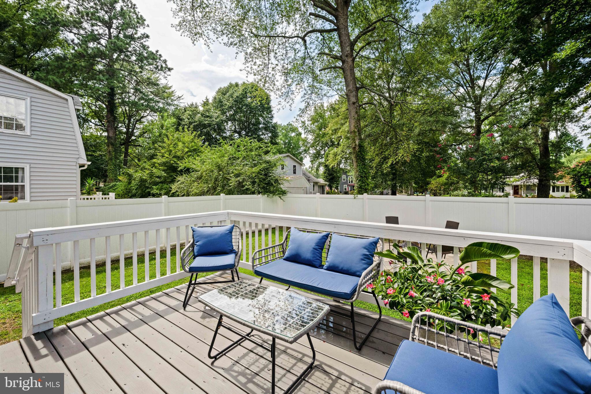 133 7th Street Colonial Beach, VA 22443 - Photo 8 of 72 a view of a chairs and table on the wooden deck